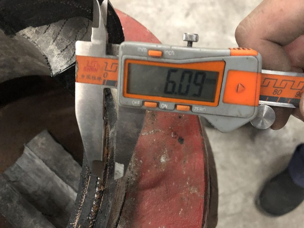 Caliper measurement of neck wall thickness on the dissected expansion joint - Devel Fluid Equipment